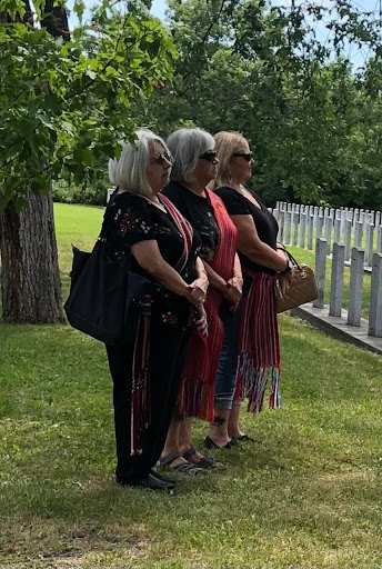 L-R Angel Delorme Stoyko, Diane Delorme Hykaway, Brenda 
				Neufeld-Lapointe proudly wearing their Métis sashes on VJ Day.