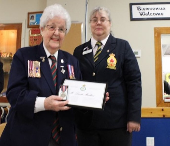 Image: Lucette Mailloux-Muir (l), accepts her medal from Cde Dawn 
				Poll, District Commander Yamaska Valley #9 RCL.