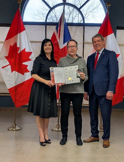 Image: Lori Atkinson Smith (c) was presented with her medal by Lisa 
				and Vance Badawey.